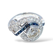 18K White Gold swirling Blue Sapphire and Natural Diamond Ring