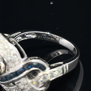18K White Gold swirling Blue Sapphire and Natural Diamond Ring