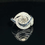 18K White Gold swirling Blue Sapphire and Natural Diamond Ring