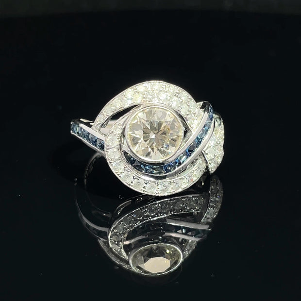 18K White Gold swirling Blue Sapphire and Natural Diamond Ring