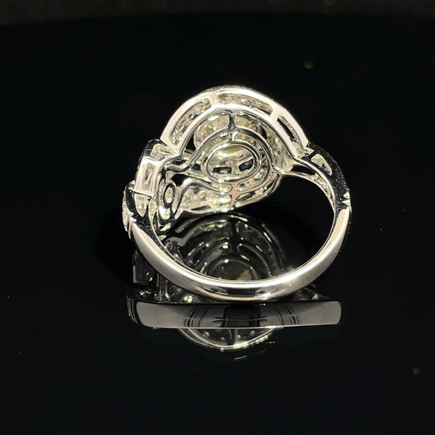 18K White Gold swirling Blue Sapphire and Natural Diamond Ring