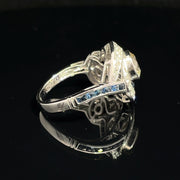 18K White Gold swirling Blue Sapphire and Natural Diamond Ring