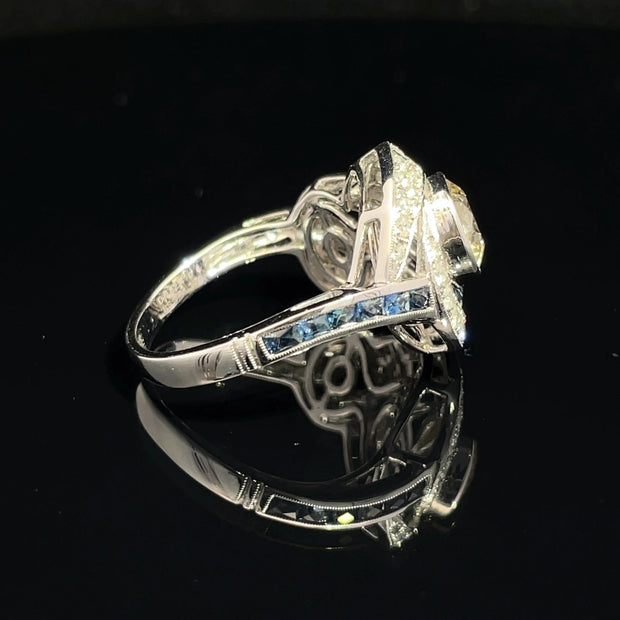 18K White Gold swirling Blue Sapphire and Natural Diamond Ring