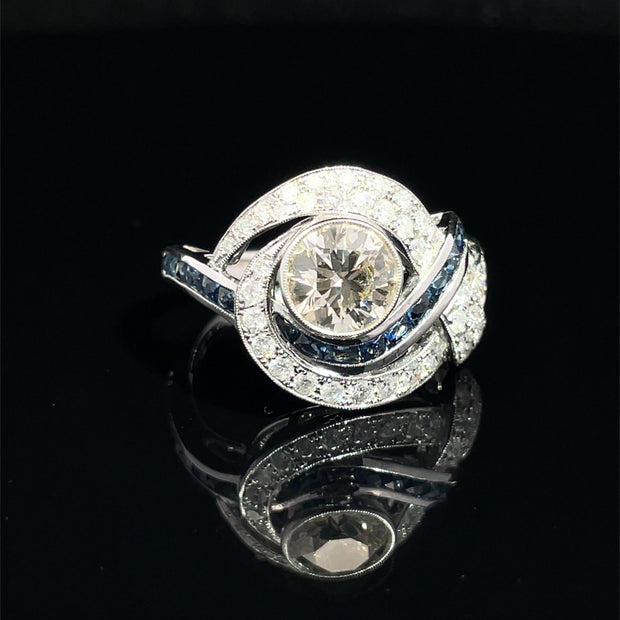 18K White Gold swirling Blue Sapphire and Natural Diamond Ring