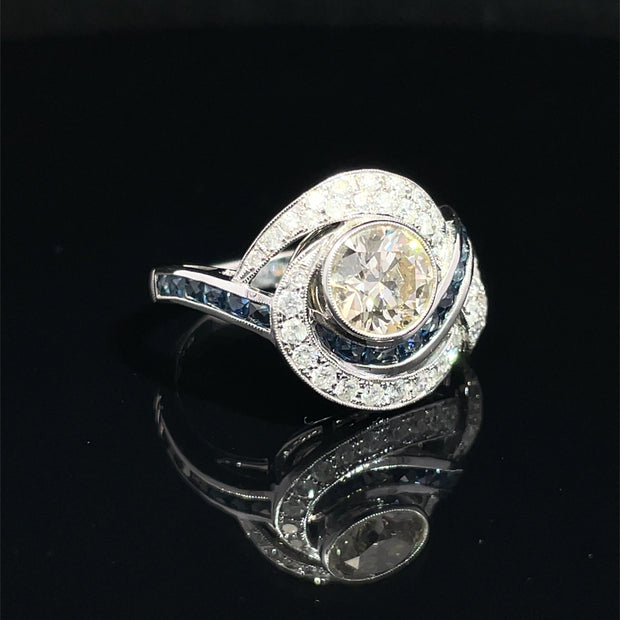 18K White Gold swirling Blue Sapphire and Natural Diamond Ring
