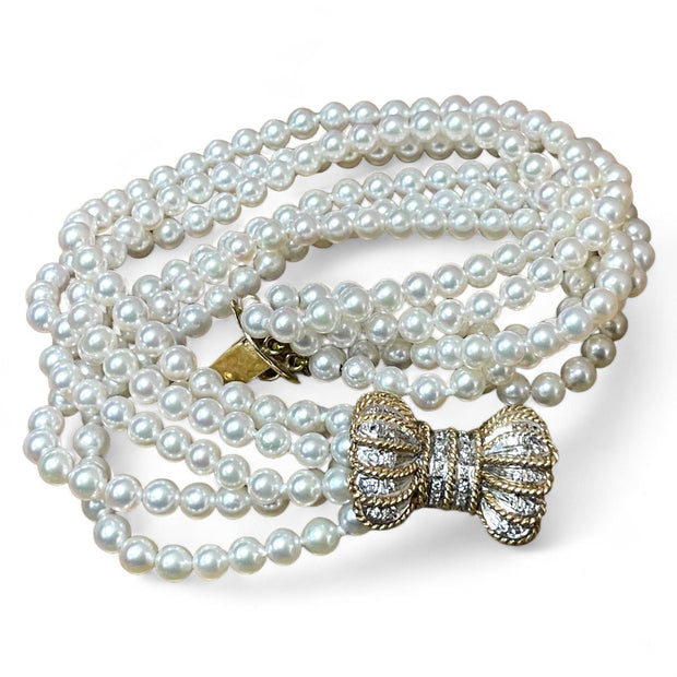 Luxurious Pearl Bracelet with Elegant 14K Gold Diamond Bow Clasp