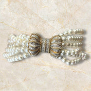 Luxurious Pearl Bracelet with Elegant 14K Gold Diamond Bow Clasp